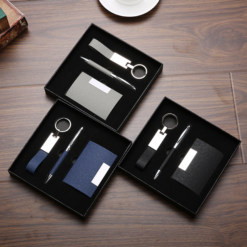 Custom gift set with personalized keychain, notebook, and business card holder.