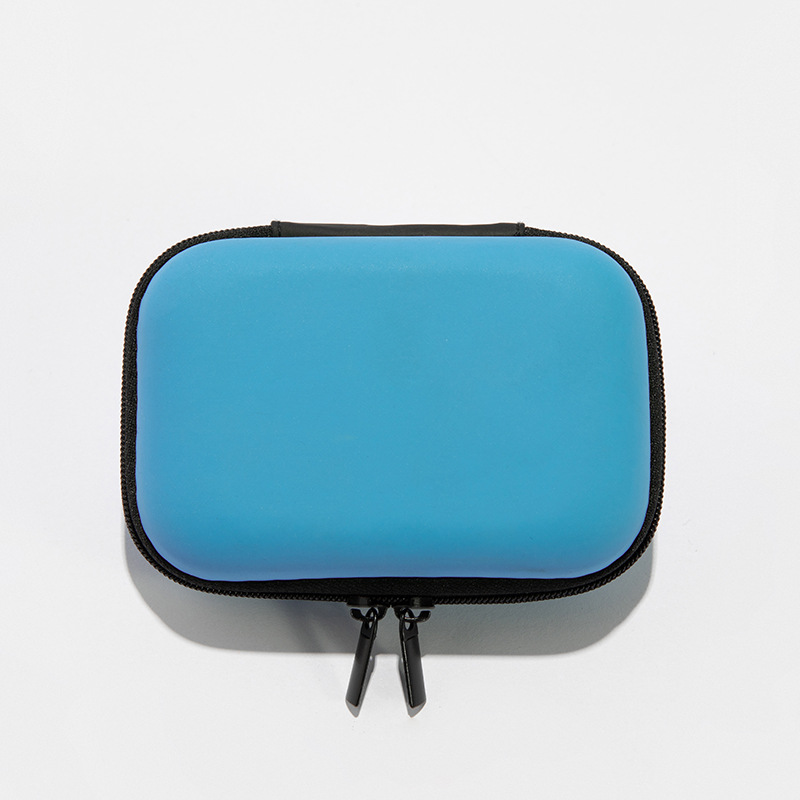 Small square zipper bag with multiple compartments for storing headphones, SD cards, USB drives, and other small accessories.